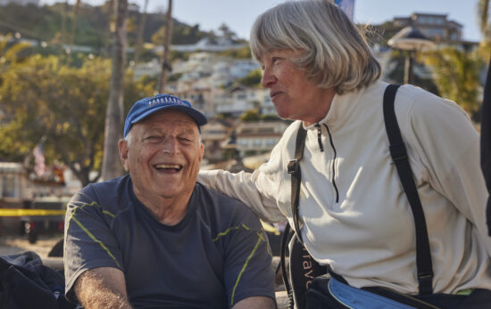 Elderly man and woman talking and smiling