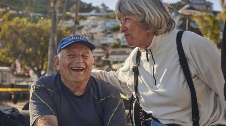 Elderly man and woman talking and smiling