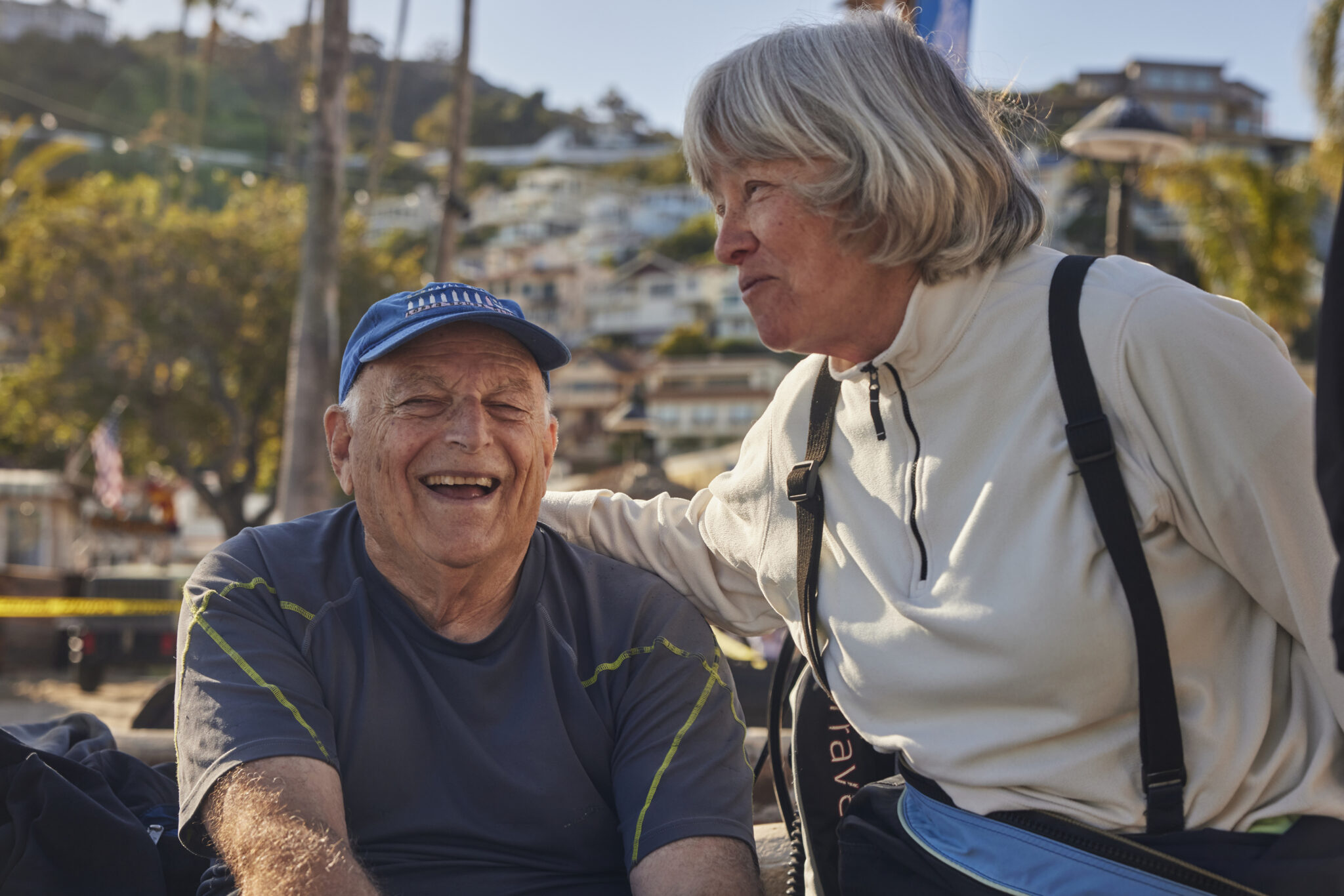 Elderly man and woman talking and smiling