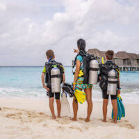 a mom and her two sons go scuba diving in the Maldives