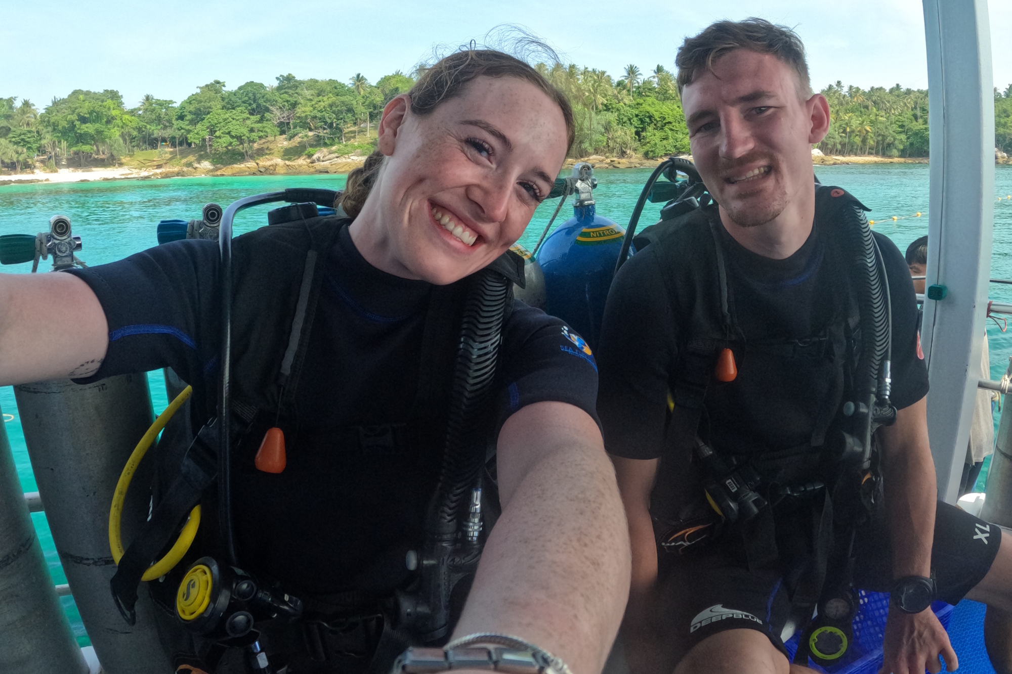 Rebecca and her partner, Bradley, getting ready to scuba dive