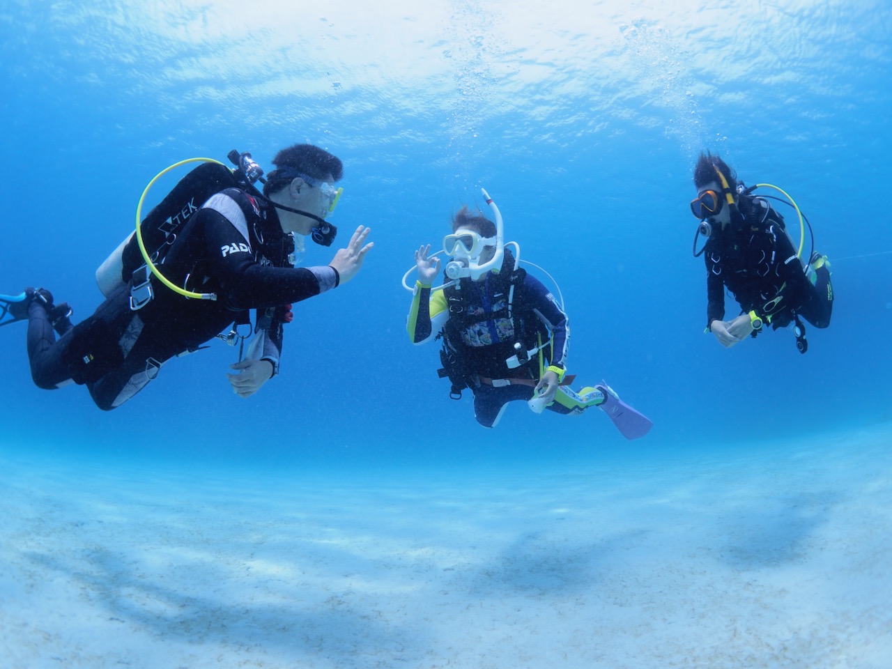 a PADI Pro teaches an Open Water Diver course in Okinawa Japan