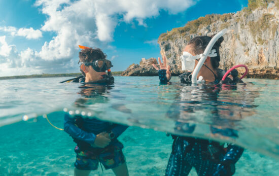 two divers communicate at the surface before a dive