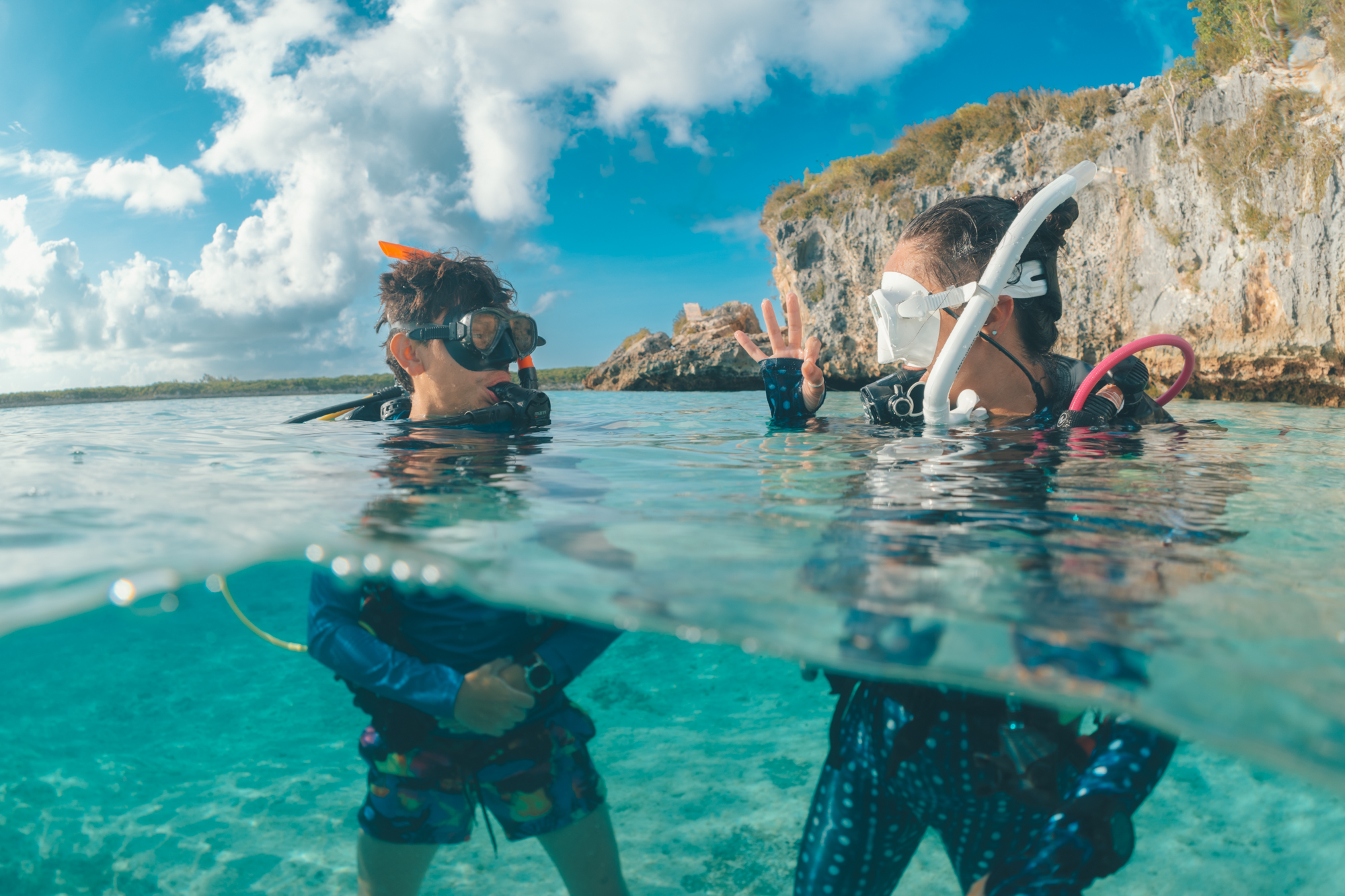 two divers communicate at the surface before a dive