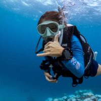 diver swimming towards camera