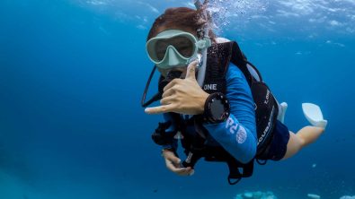 diver swimming towards camera