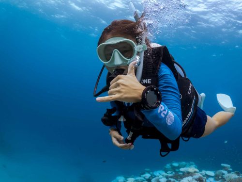diver swimming towards camera