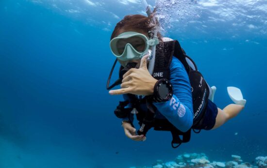 diver swimming towards camera