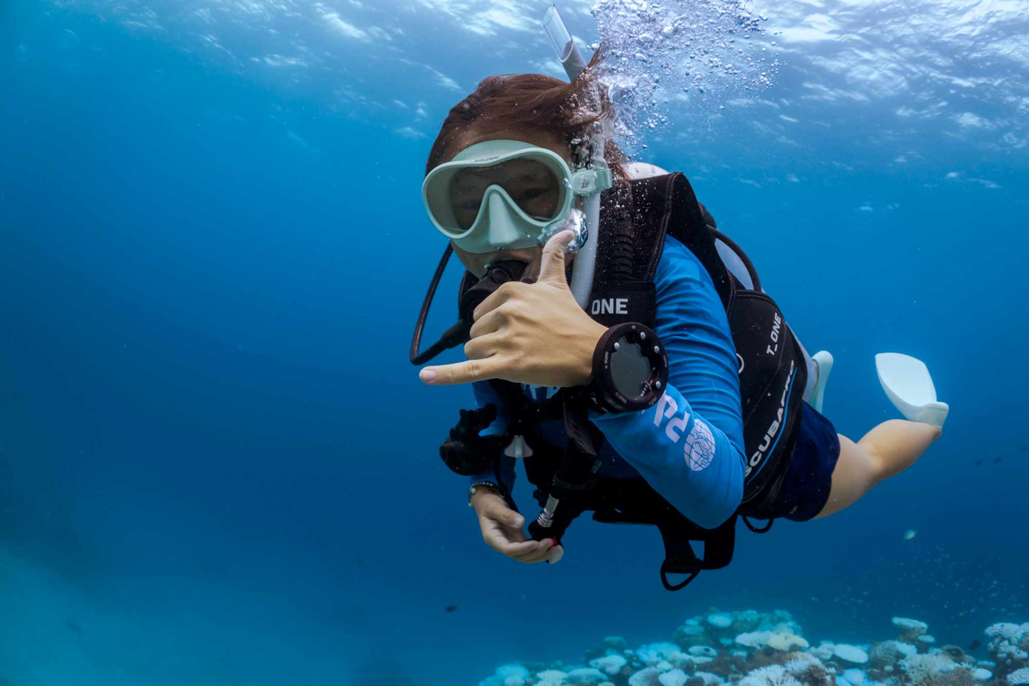 diver swimming towards camera