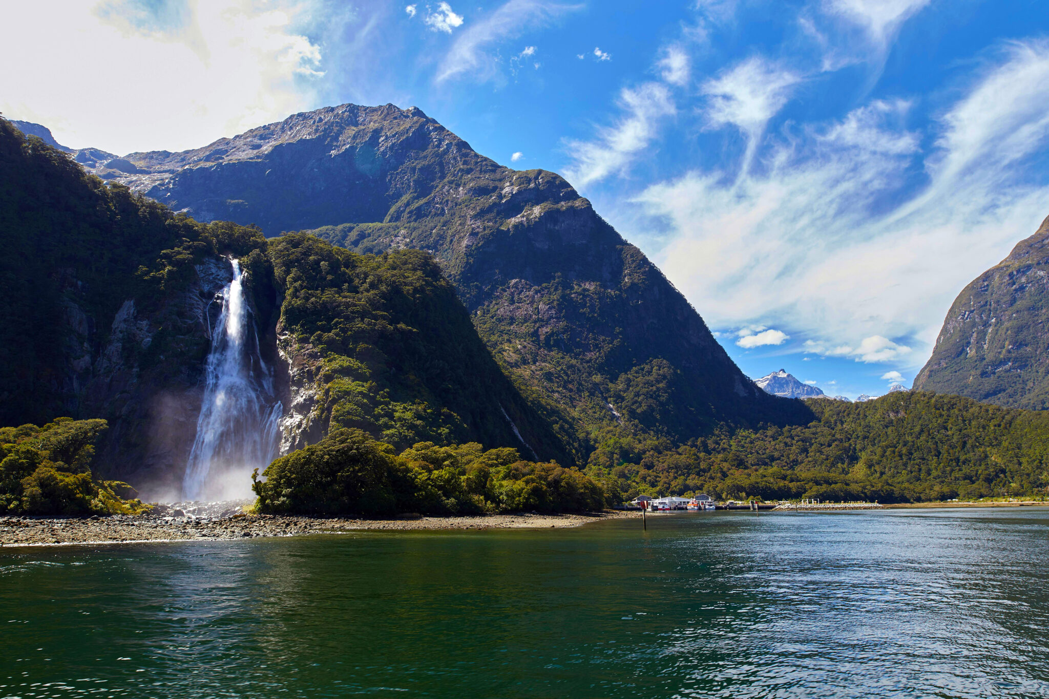 Milford Sound in New Zealand A tall waterfall at Milford Sound in New Zealand, where Great Walks make this one of the best places for hiking and diving