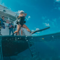 diver jumping off boat become an advanced diver