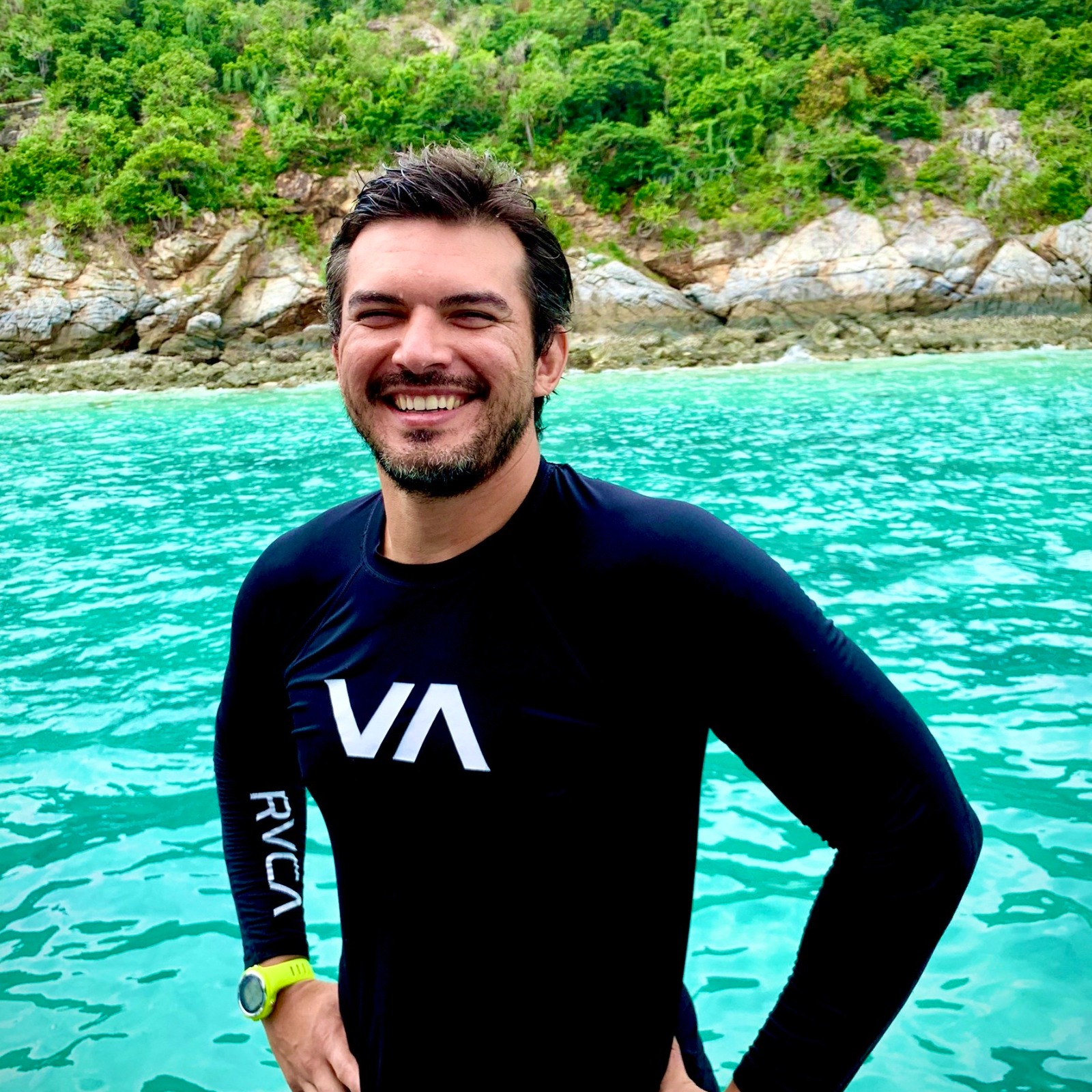 Larry Martin smiles for the camera on a boat in the ocean