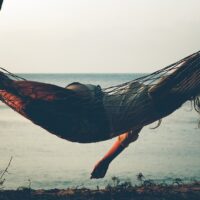 Girl in a hammock on the beach