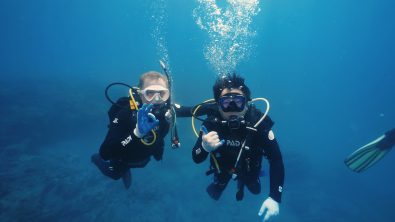 Drew Richardson and actor Huang Bo underwater