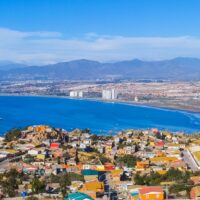 A view of the town of La Serena, Chile overlooking a blue water bay