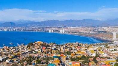 A view of the town of La Serena, Chile overlooking a blue water bay