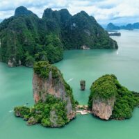 Khao Tapu, James Bond Island, aerial shot from a drone, blue sea, emerald green, is a popular tourist attraction in Southern Thailand.
