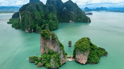 Khao Tapu, James Bond Island, aerial shot from a drone, blue sea, emerald green, is a popular tourist attraction in Southern Thailand.