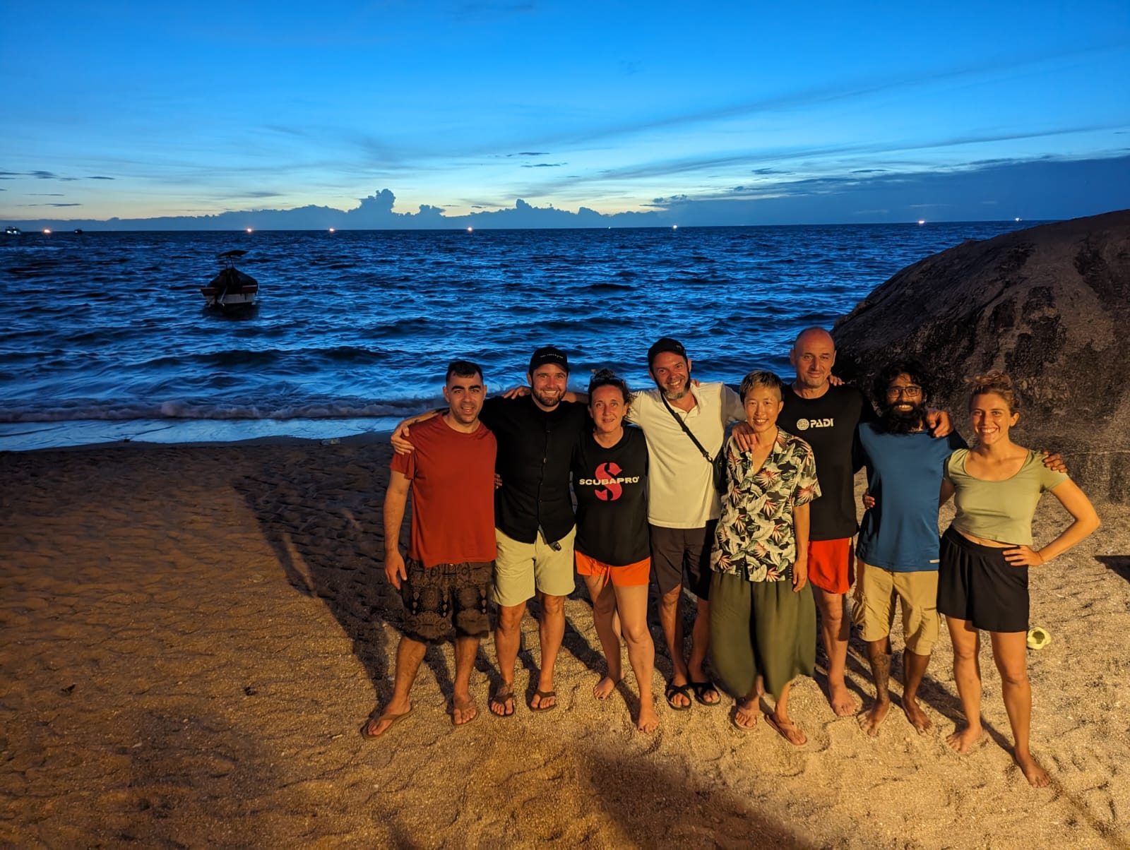 Group of freedivers from a Master Freediver and Instructor standing on the beach