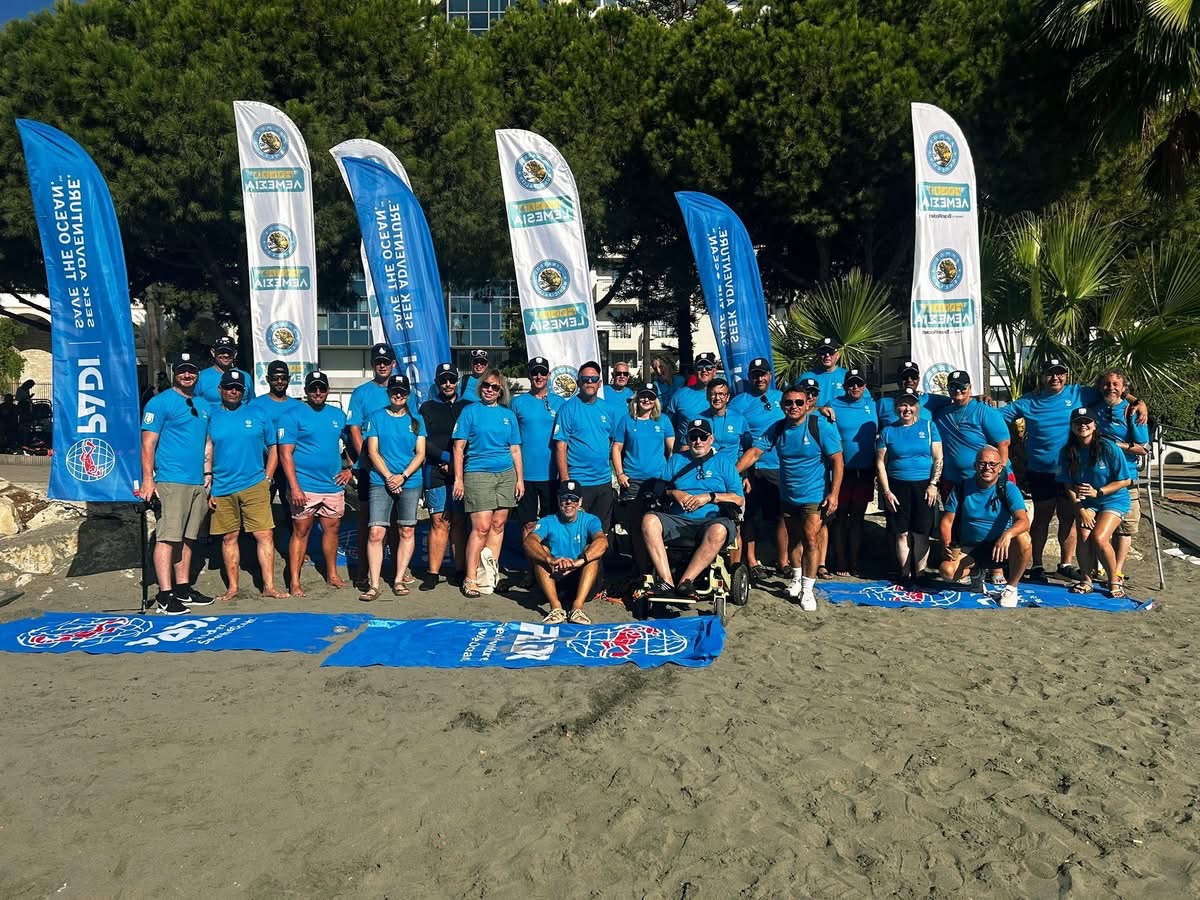 Group of divers on the beach for the D