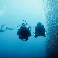 three divers on a deep diver training course