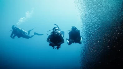 three divers on a deep diver training course