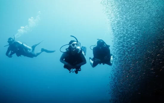 three divers on a deep diver training course