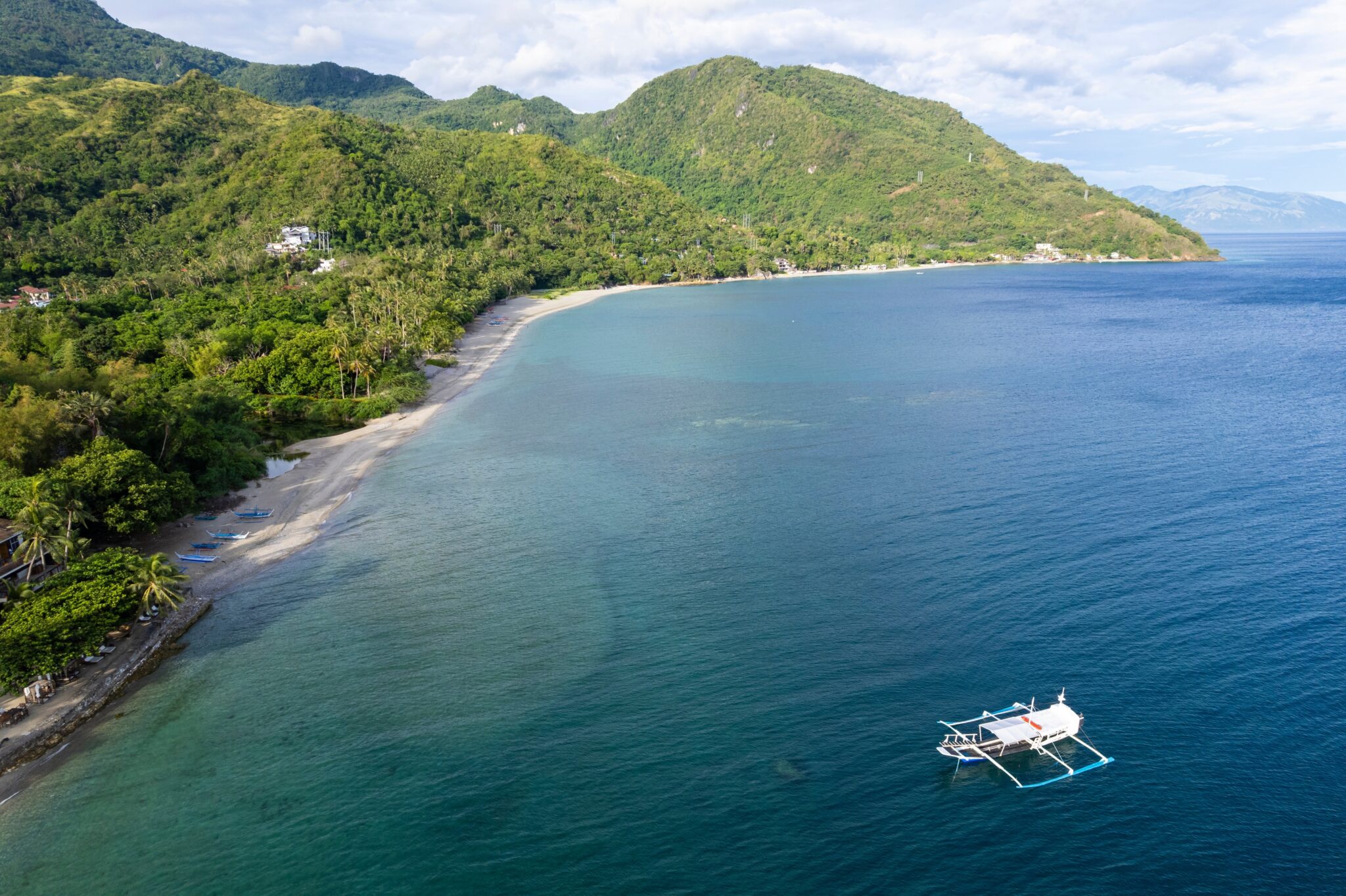 Aerial view of Aninuan and Talipanan Beach, Puerto Galera, Philippines, with surrounding nature.