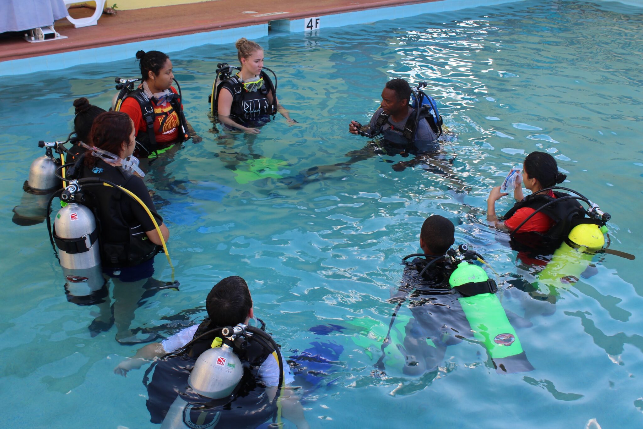 Les Burke- Ocean Torchbearer Award Winner - teaching a group of kids in a pool