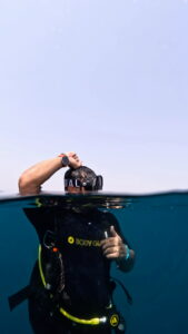 Course Director Mudasir Wajid signals okay to the boat after entering the water