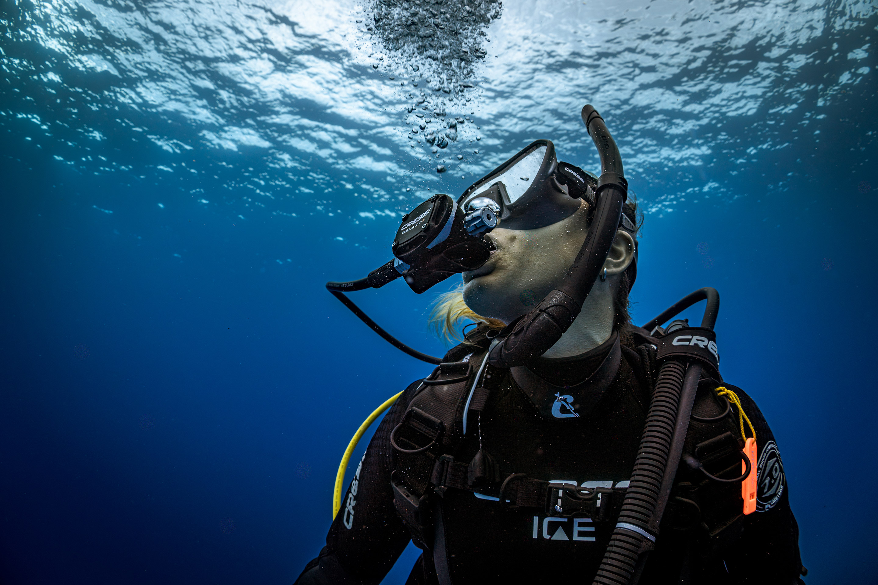 diver underwater looking towards the surface