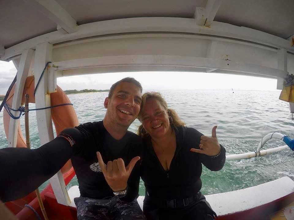Two divers taking a selfie on a boat - Bali Crystal Divers