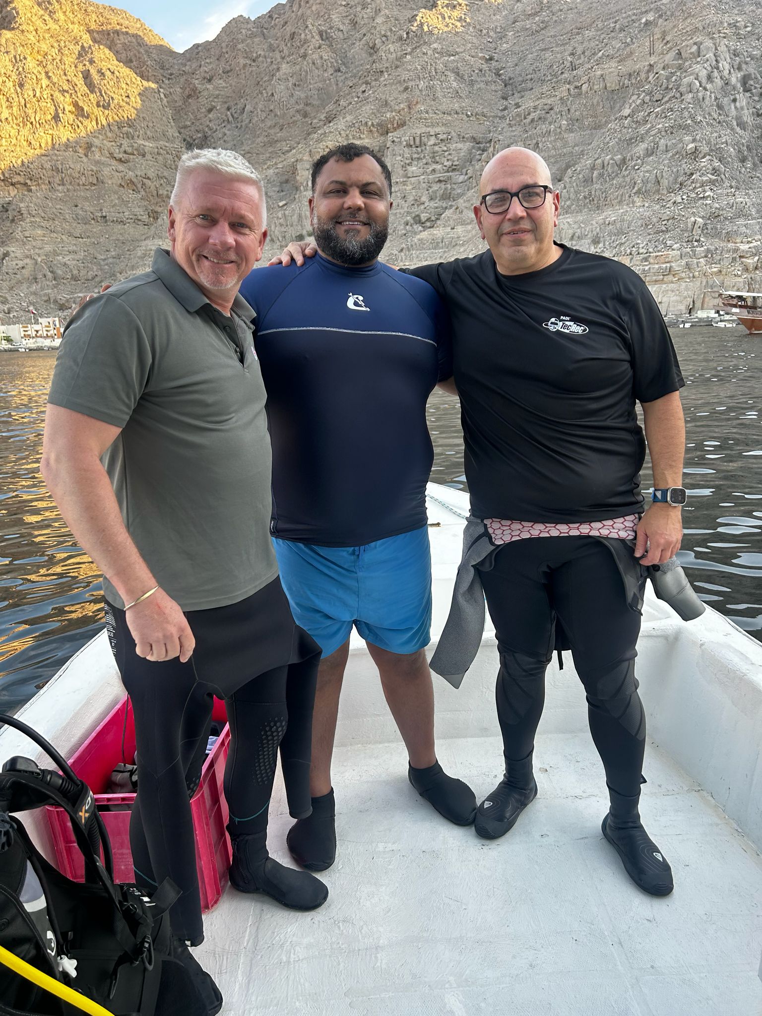 Jason Sockett and two other divers on a boat in Musandam