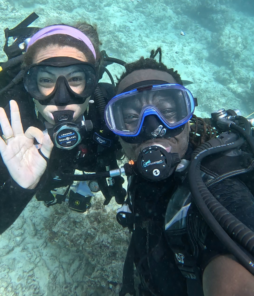frank mollel padi ambassadiver underwater with a fellow instructor