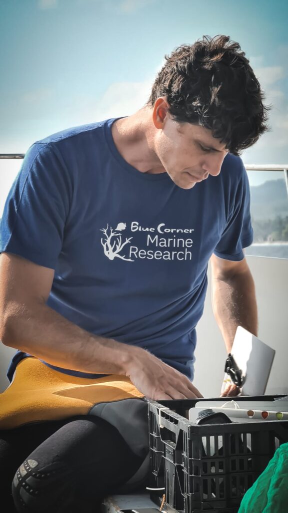 Andrew Taylor, Ocean Torchbearer Awardee, preparing gear on a boat