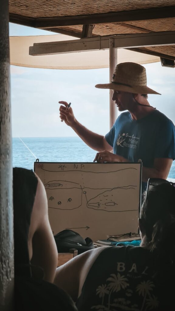 Andrew Taylor, Ocean Torchbearer Awardee, giving a briefing to train coral restoration volunteers