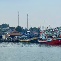 Photo of Samaesan Pier in Thailand with several large fishing boats