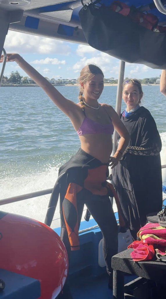 Scuba diver on a boat dancing