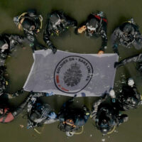 course participants from above with flag