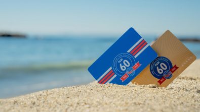 Two certification cards showing PADI's 60th anniversary logo in sand