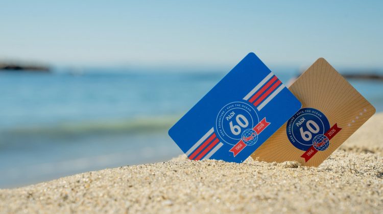 Two certification cards showing PADI's 60th anniversary logo in sand