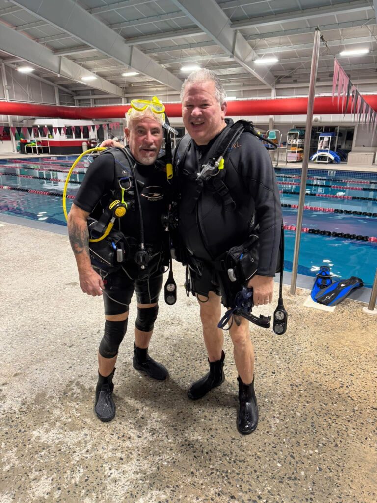 Curt Tomlinson, winner of the 2025 MSD Challenge, poses for a picture with a friend next to a swimming pool