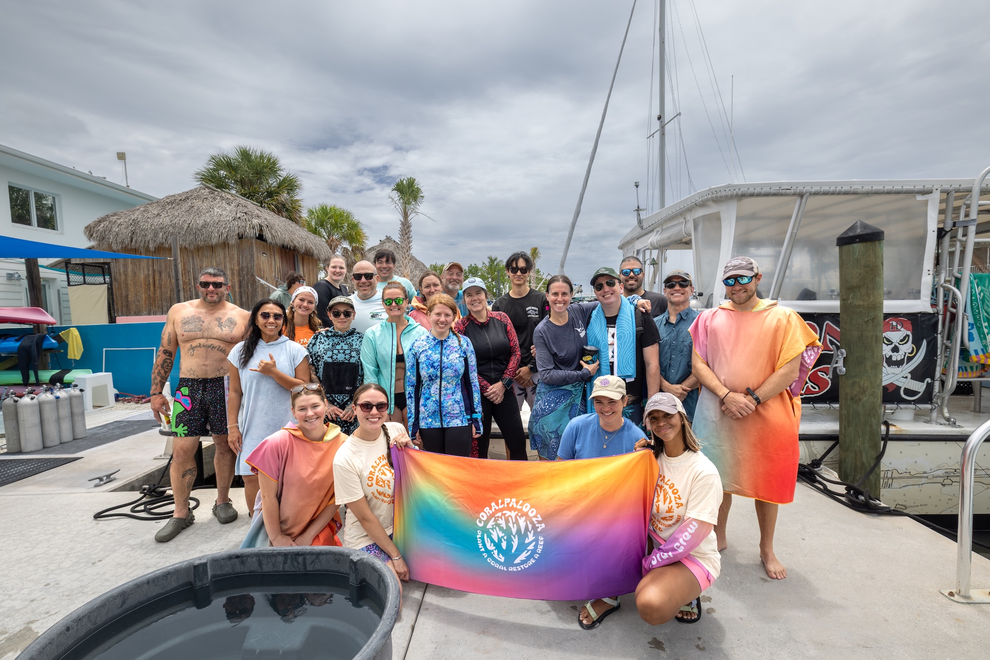 divers and volunteers posing for a group photo