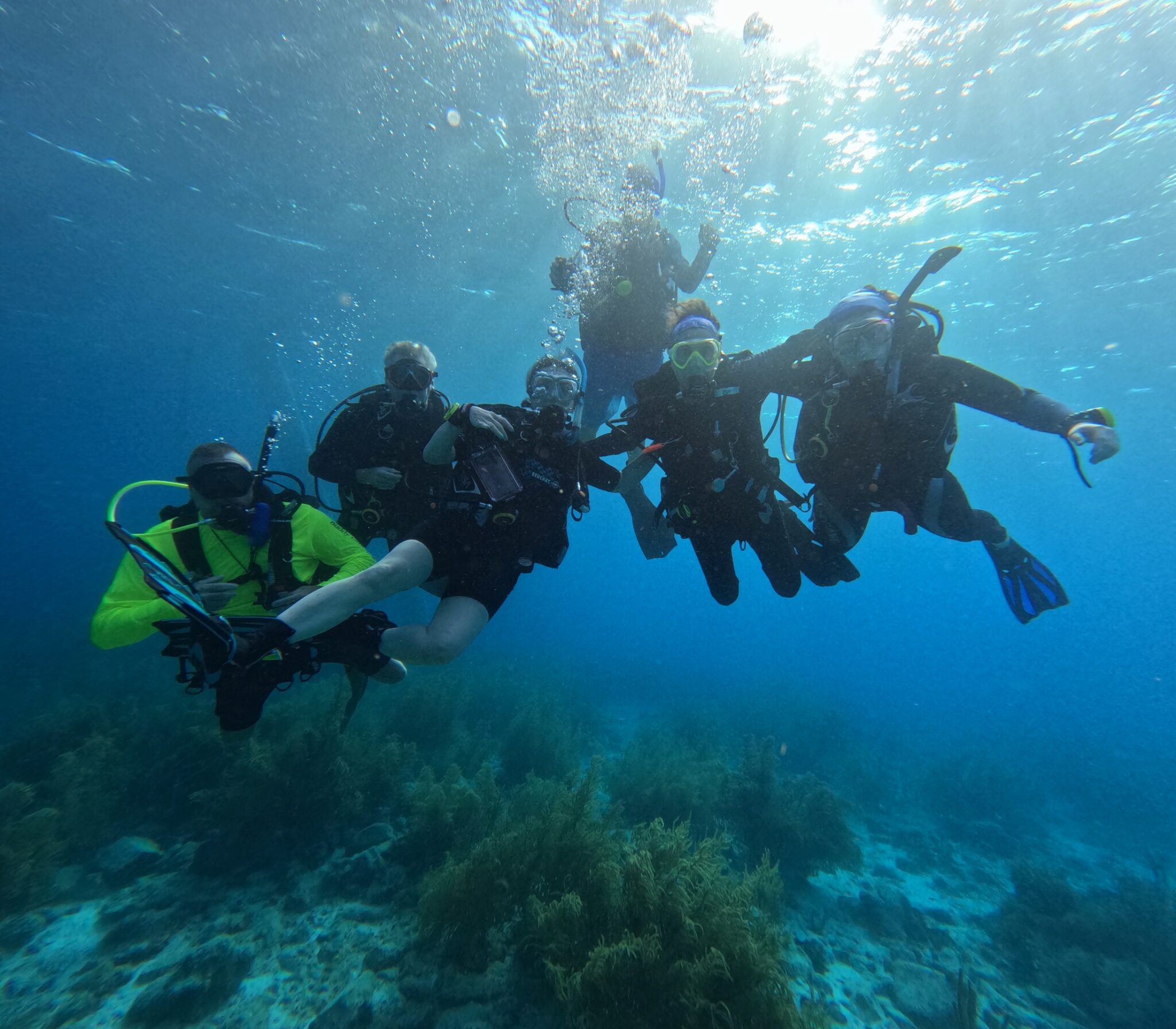 A group photo of PADI Club Bonaire 2026 divers underwater