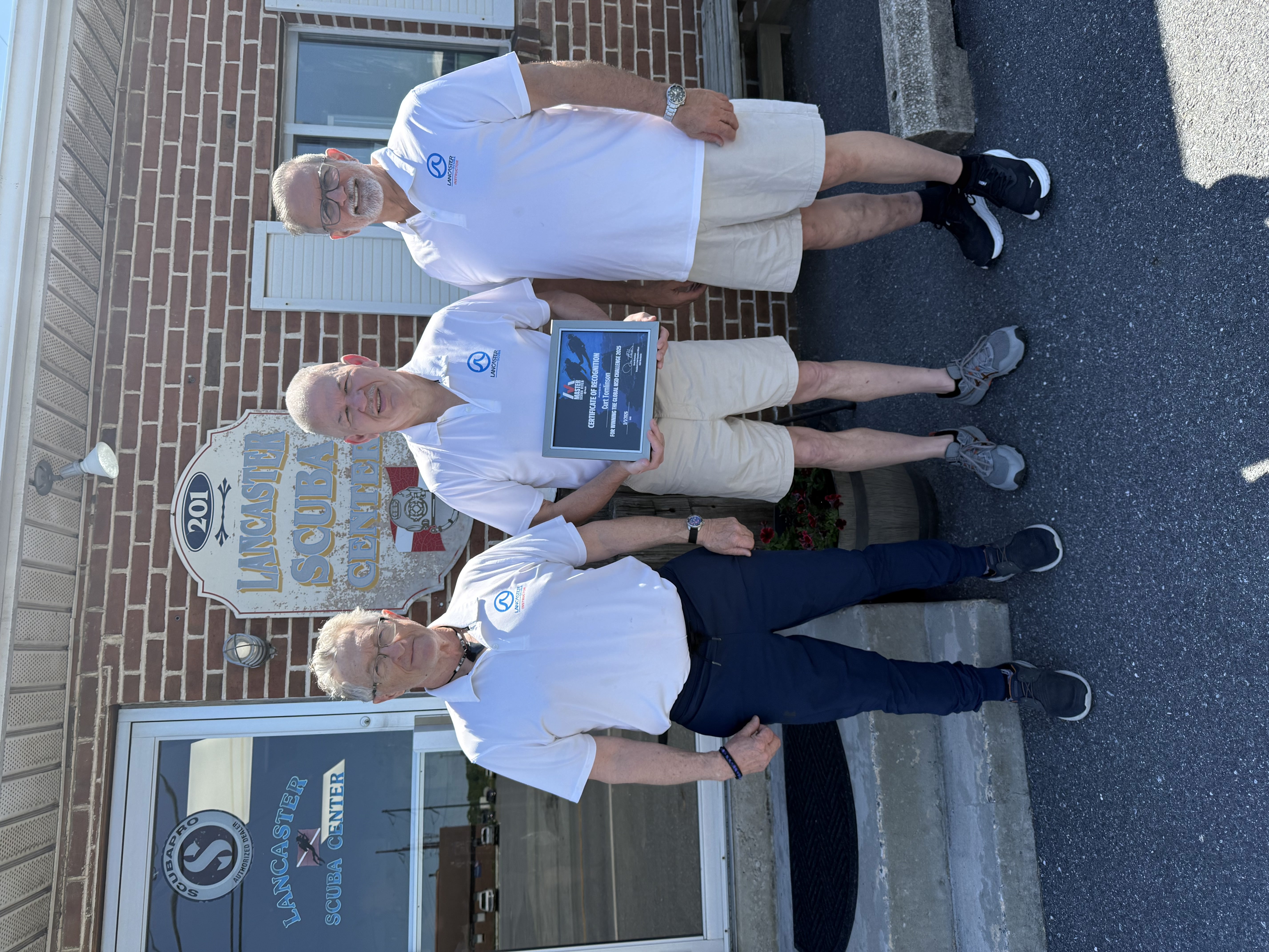 Curt and team in front of a dive center in Pennsylvania
