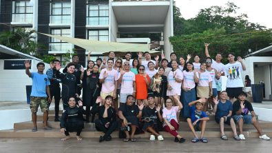 Divers gathering for a group photo on the surface before a WDD cleanup in Batangas, Philippines