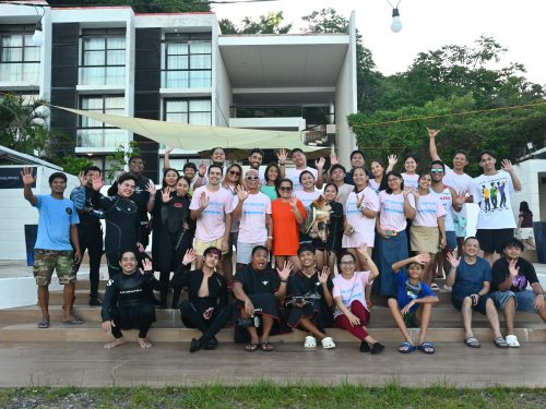 Divers gathering for a group photo on the surface before a WDD cleanup in Batangas, Philippines