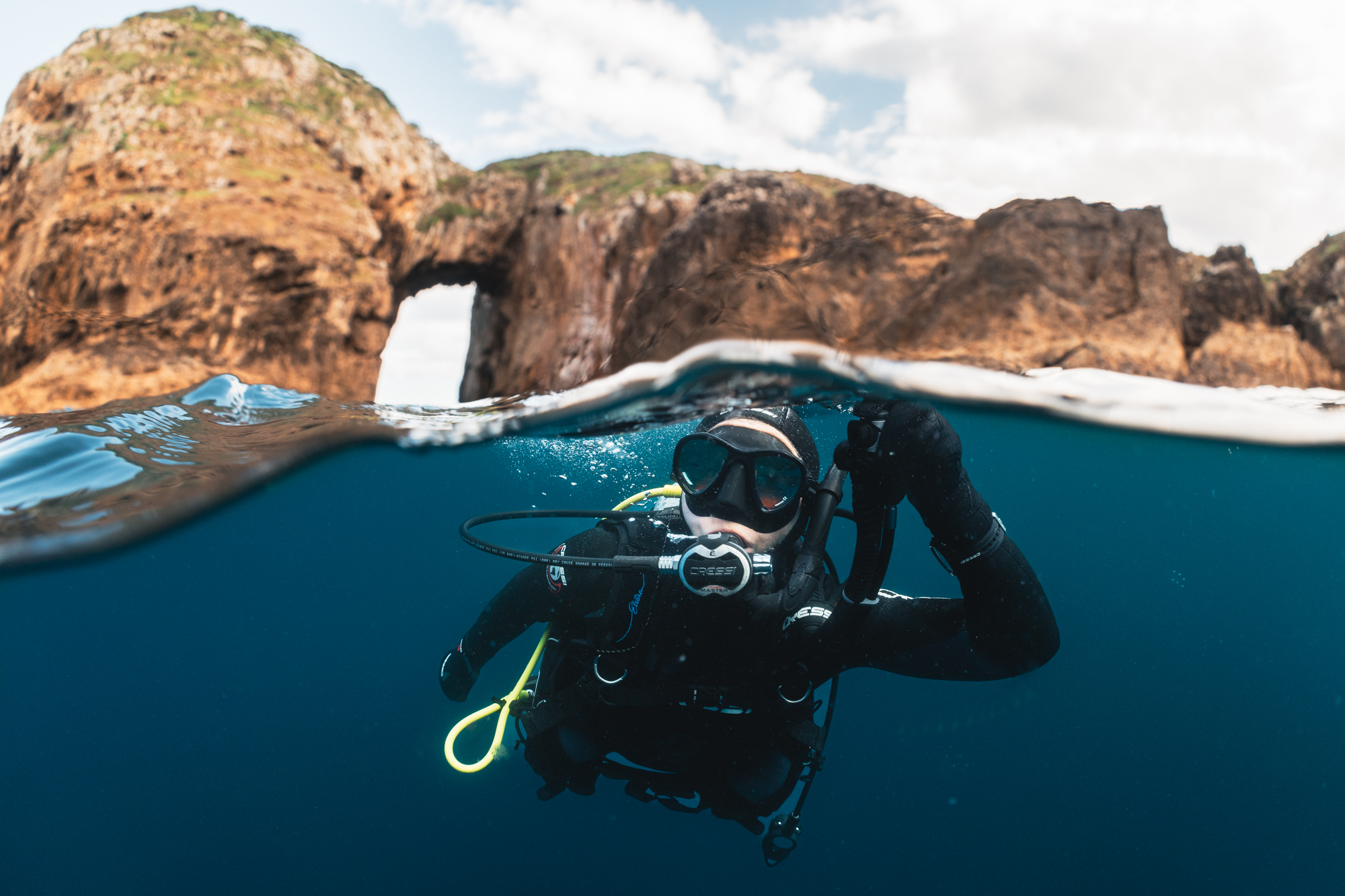 A diver surfaces with the proper ascent rate in scuba diving, as a common mistake during a scuba ascent is going too fast