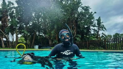 Ocean Torchbearer Award Winner Amanda Van Jaarsveld in scuba gear standing in a pool