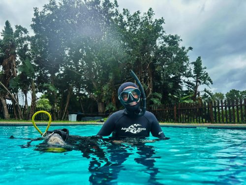 Ocean Torchbearer Award Winner Amanda Van Jaarsveld in scuba gear standing in a pool